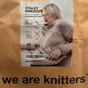 Yarn, needles and sweater pattern kit